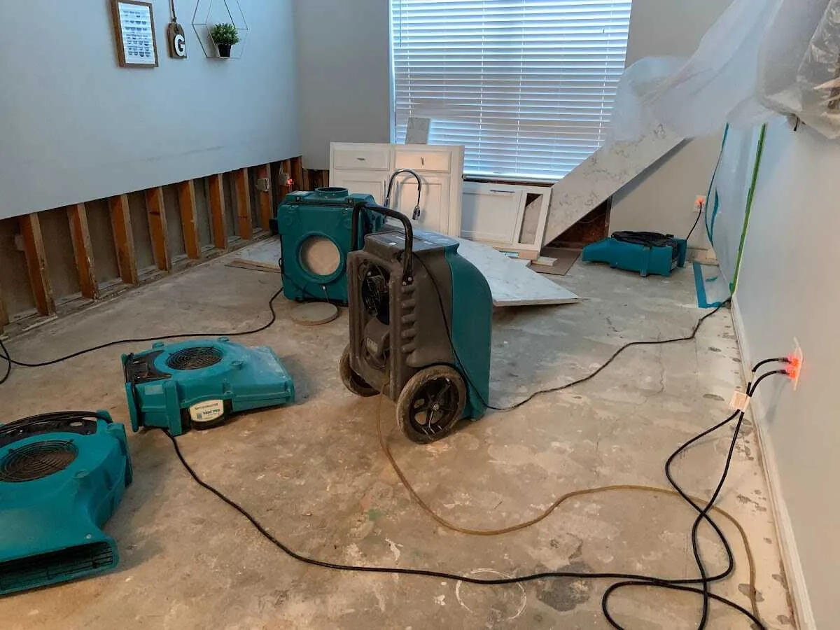 Dehumidifier in flood-cut room for Water Damage Restoration in Ridgewood village